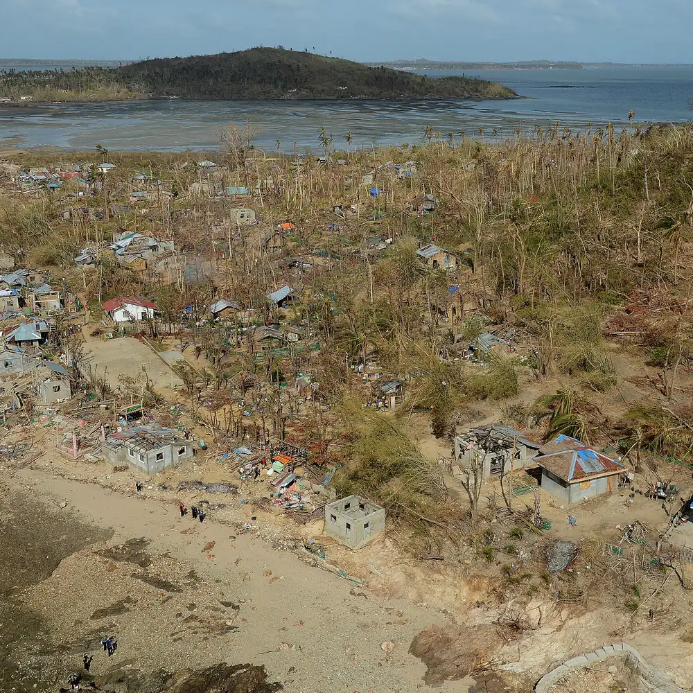Aerial view of an island village devastated by a typhoon